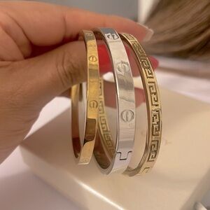 3  bangles.   2 gold 1 silver